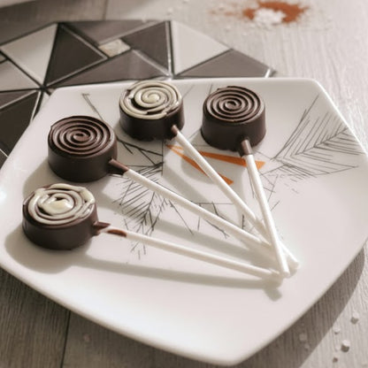 Chocolate candies on a decorative plate with geometric patterns